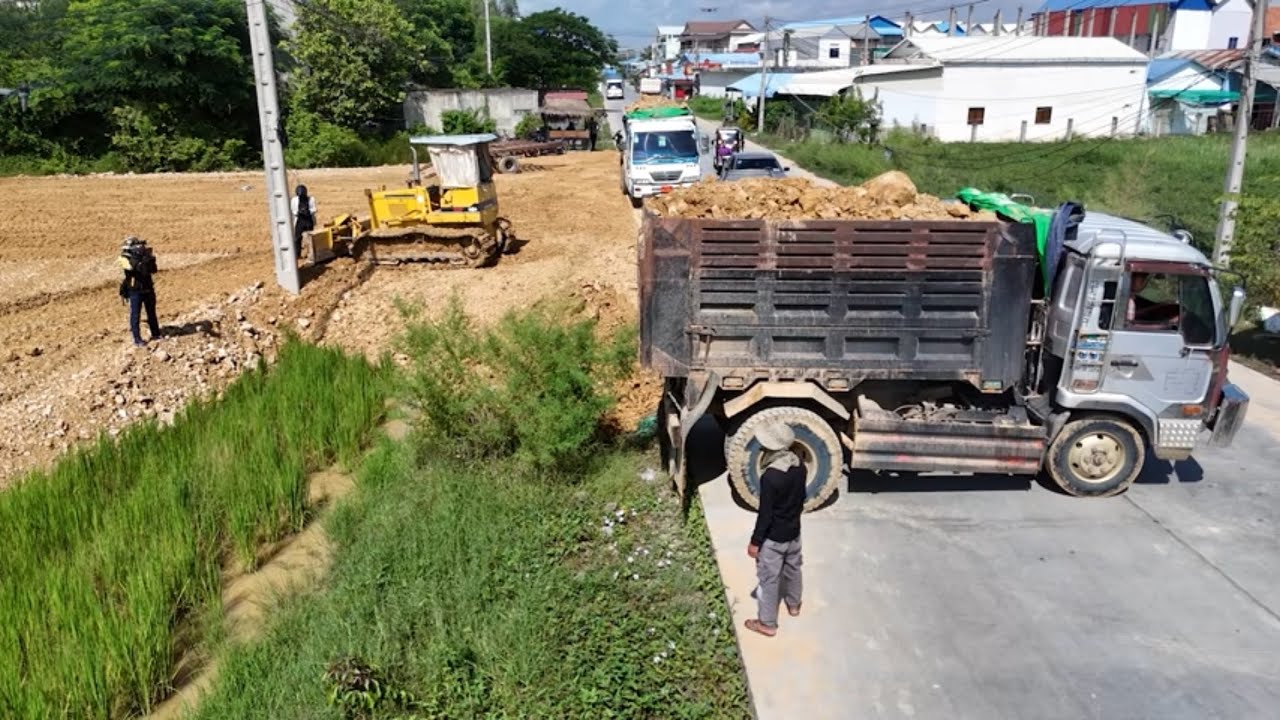 Good Job! Skilled operation! Using Komatsu D31p Dozer and 6-Wheel Dump Trucks to fill flooded land