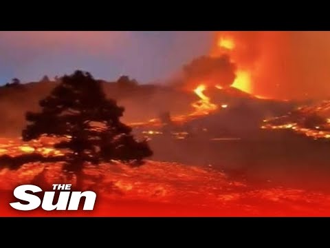 La Palma volcano - Red-hot lava spews from cater on Spanish island