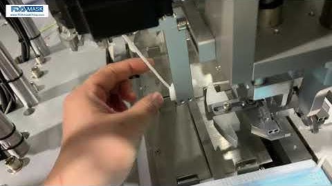 Ear loop wire hanging problem by adjust ear loop camp gripper position high on welding machine