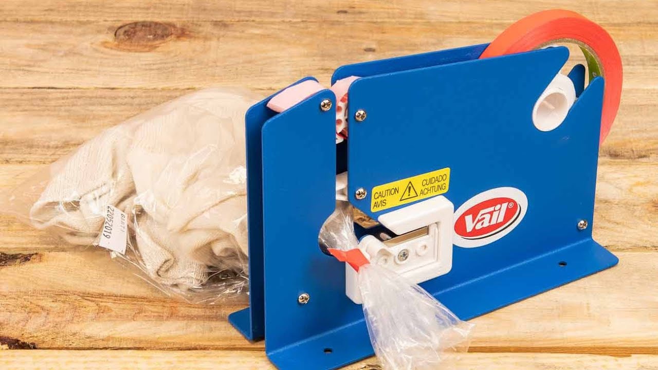 Máquina precintadora cierra bolsas VAIL, metálica, con cuchilla y cortador  de sobrante 
