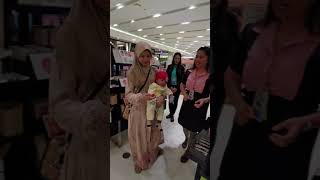 Filipino Muslim Wife with Baby Buying Makeup at SM Mall