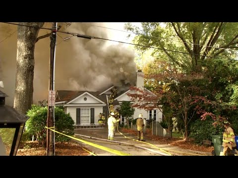 Raleigh firefighter loses control of hose battling house fire