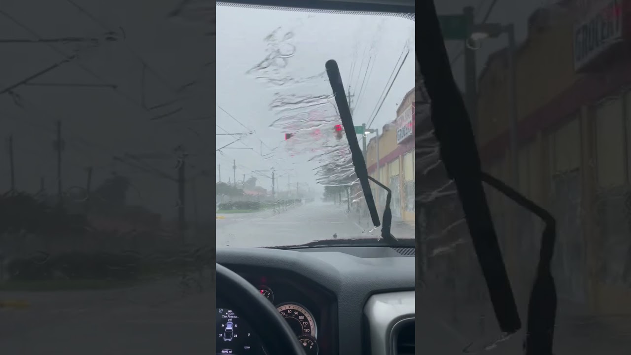 Drive POV stuck in a rain storm 