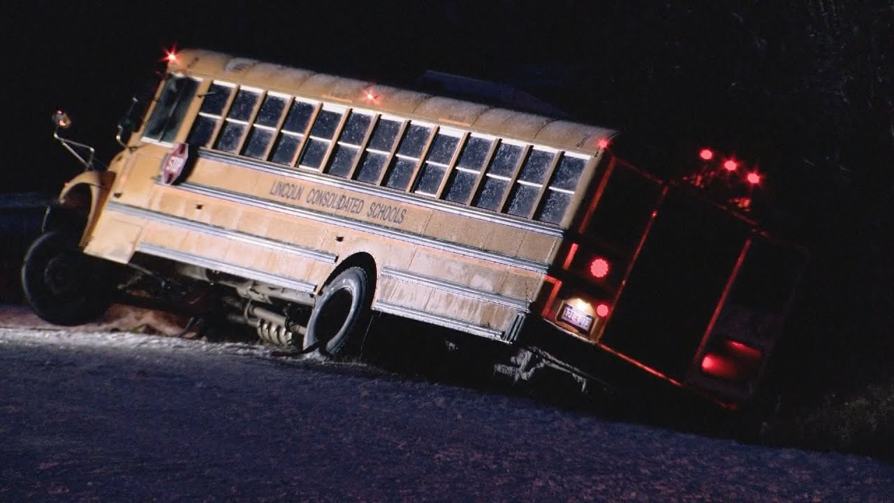 School bus carrying 30 children spins out on ice, crashes into ditch in ...