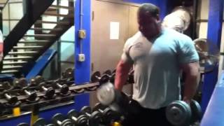 Derek Poundstone curling 80lb DB