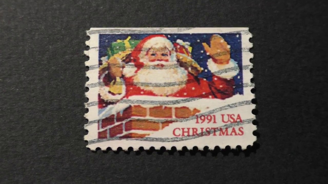 Postage stamp. USA. CHRISTMAS. Santa Claus with gifts. 1991