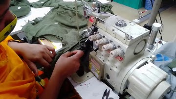Elastic attach at mash part leg opening by elastic metering device with Overlock machine