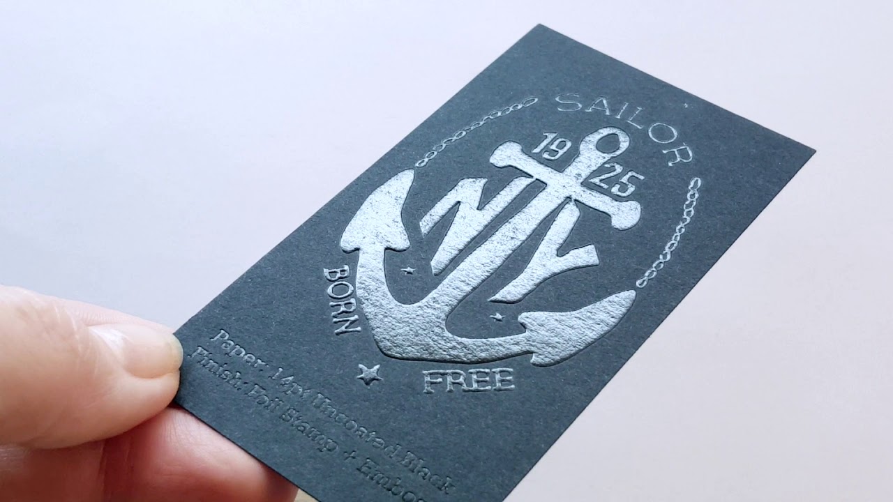 embossed business card on black paper with black foil stamp