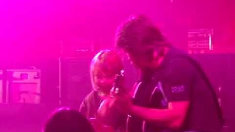Keith Urban Brian Nutter plays guitar with a little girl