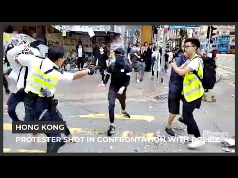 Hong Kong protester shot in street confrontation with police