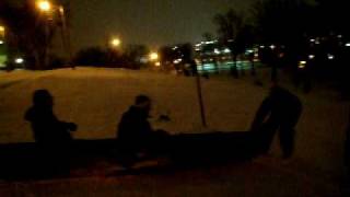 Drunk guy in shopping cart vs. guys in canoe sledding