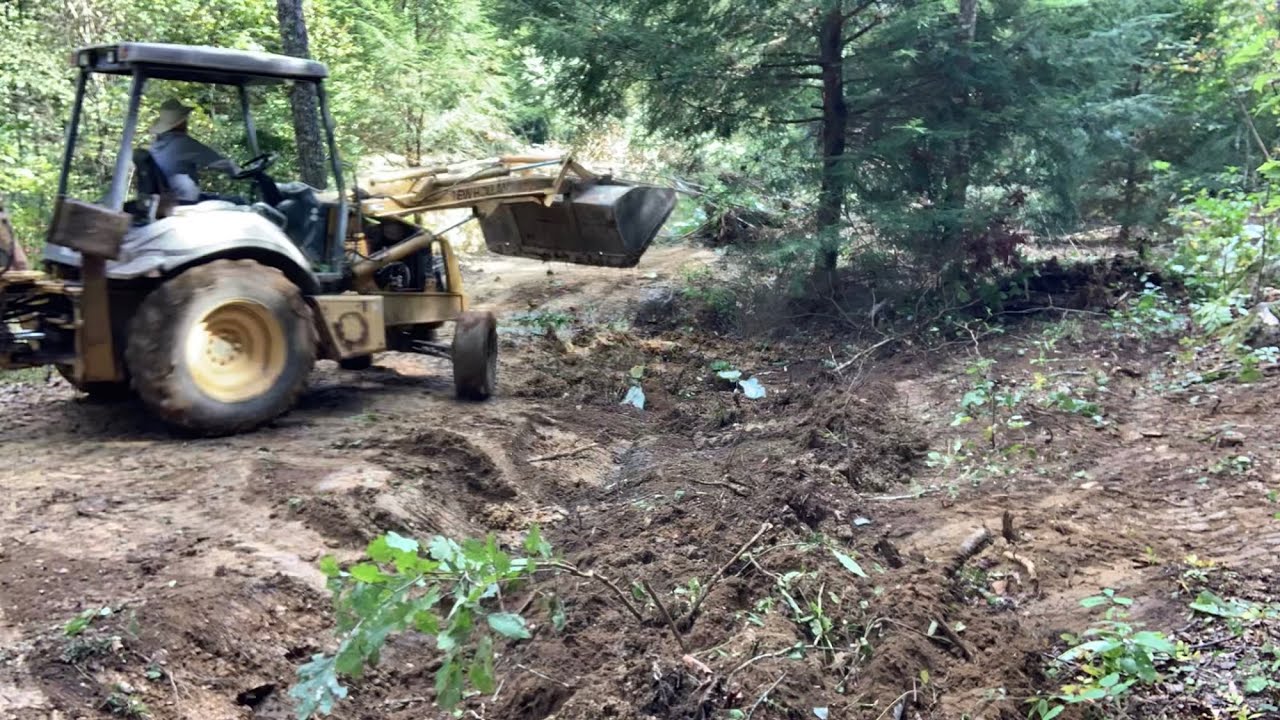 Land Clearing With A Backhoe - YouTube