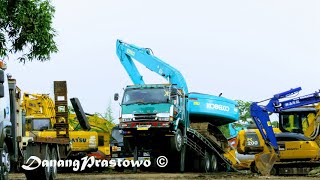 Long Reach Excavator Transport By Fuso Self Loader Trucks Kobelco SK210LC