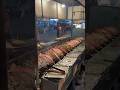Massive grilled red tilapia fish on giant stove