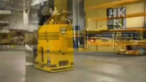 ROLLERFORKS® - Slip-Sheet Attachment on AGV Dematic