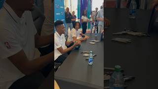 Hornets rookies Brandon Miller and Nick Smith Jr. signing autographs for fans in Charlotte