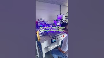 Four station rotary screen printing machine. Equip with UVLED lights and a cutting robot.