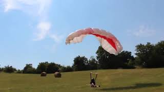 Man Lands On His Butt When He Goes Paragliding Towed To A Car