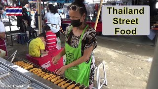 Homemade Thai Fishcakes cooked on spinning bamboo skewers.