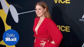 Amy Adams arrives looking radiant in red at the Vice Premiere
