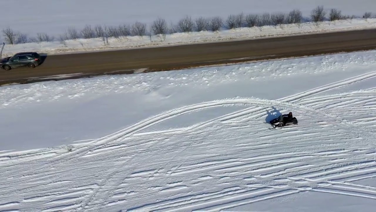 Potensic Atom 2 drone follows snowmobile on a beautiful winter day in Ontario