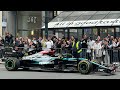 Lewis hamilton driving f1 car on fifth avenue for the empire state building 