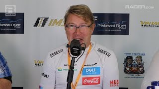 Mclaren's two-time formula 1 world champion mika hakkinen and ceo zak
brown visit with racer's marshall pruett at the rolex monterey
motorsports reunion wher...
