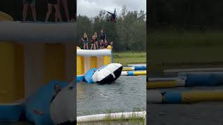 Guy jumps on blob that sends boy flying then he lands on his back in water