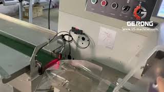 Face mask ear loop strip folding system with automatic bag packaging machine