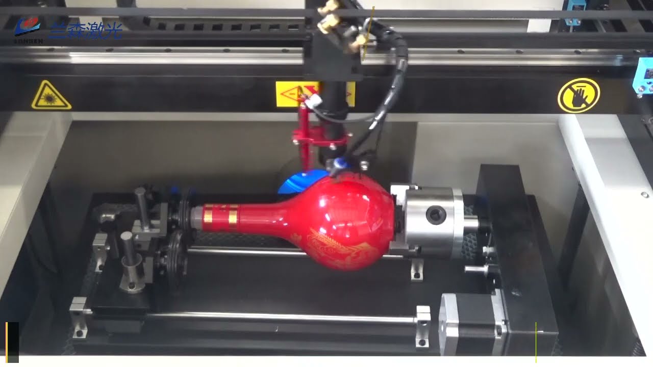 Laser engraving with rotary device to engrave patterns on glass bottles