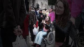 🌸 A young girl, on wheelchair, approaches the royal guard. 🦼