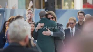 Tom Cruise shows up for Brad Pitt’s ‘F1’ premiere