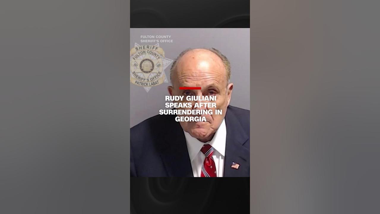 Rudy Giuliani speaks after surrendering in Georgi