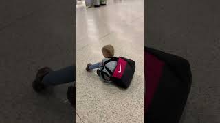 Little Girl Falls While Carrying Heavy Bag - 1502852