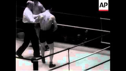 WOODCOCK KNOCKS OUT GEORGES MARTIN