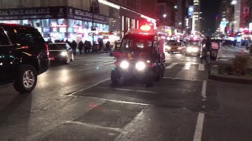 2 FDNY EMS GATORS RESPONDING URGENTLY ON 8TH AVENUE IN MIDTOWN AREA OF MANHATTAN IN NEW YORK CITY.
