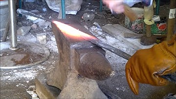 hand forging a sword from a Solid round bar part 2 forging the tang and the edge and ridge / taper