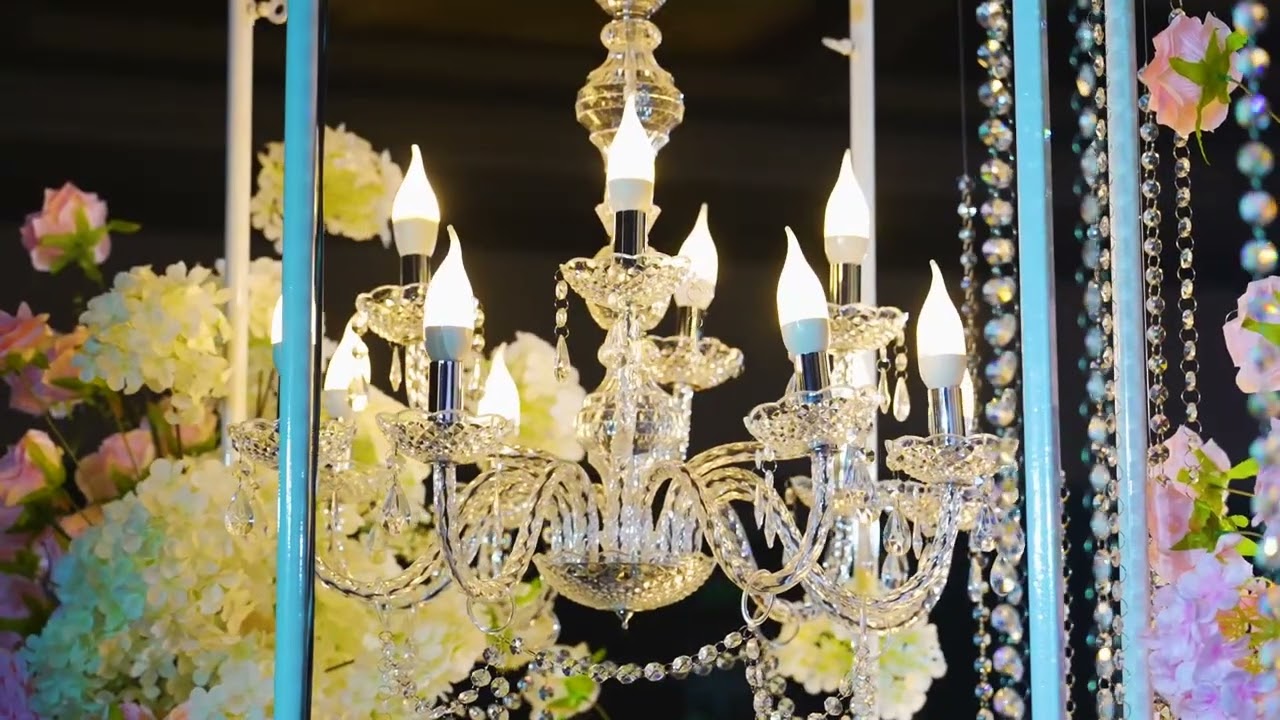 Luxury hotel ballroom wedding decoration in Kuala Lumpur with floral stage and warm uplighting