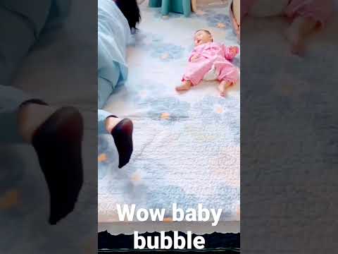 Mom teaching small baby lets roll lovely - wow baby bubble