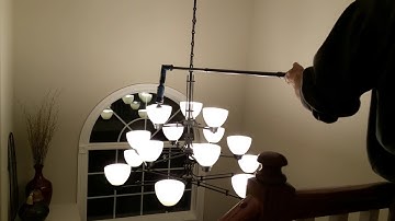 Giraffe motorized light bulb changing system