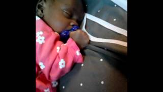 London trying to crawl in her sleep at 4 weeks old