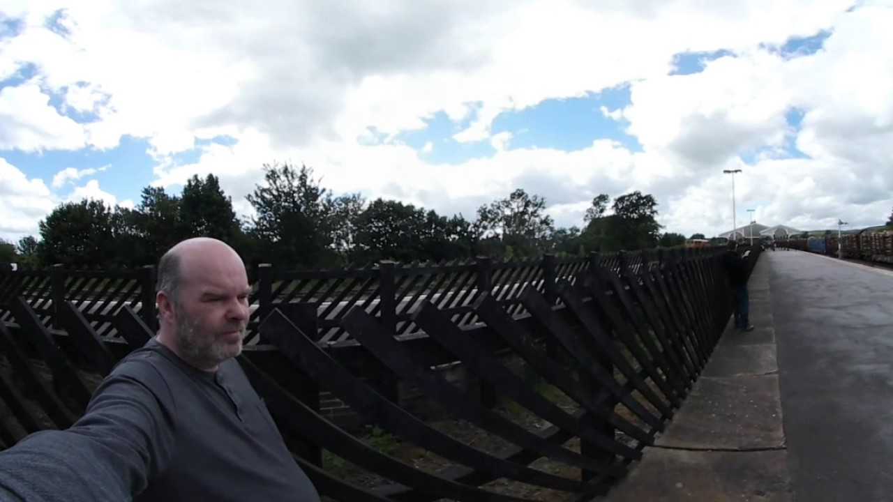 Colas Lumber train passes through Hellifield Station