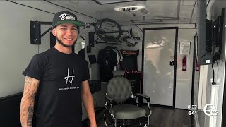 He traded his boxing gloves for scissors and now runs a mobile barbershop