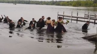 WATCH: Wedding party falls into lake when dock collapses screenshot 3