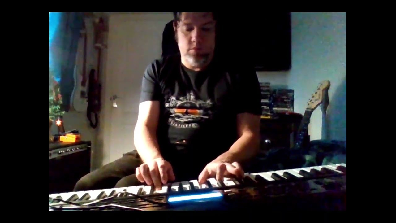Guitarist Playing Terminator Theme on New Keyboard. Short Video