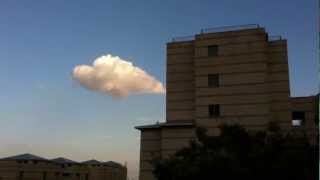 Lonely cloud in the sky suddenly met a high building