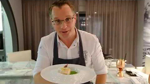 Chef Onno Kokmeijer presents his seabass dish at r...