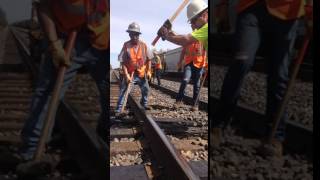 Railroad spiking by hand