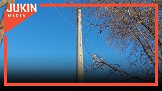 Spectators Watch Demolition Of Television Tower