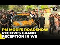 Pm modi holds a roadshow in west bengals raiganj ahead of ls polls